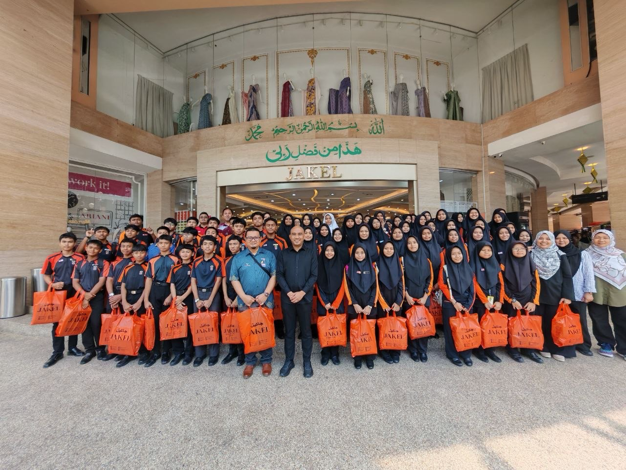 Documentation from the 2026 Raya clothing and monetary aid ceremony